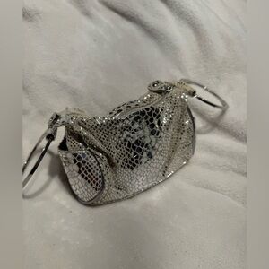 Chris by Christopher Kon silver leather wristlet